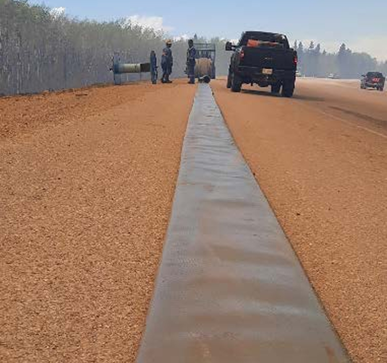 Metal strip laid along roadside near wildfire scene